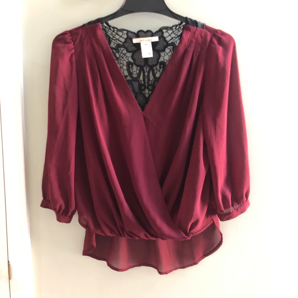 Francesca’s High-low, lace back, long-sleeve shirt
